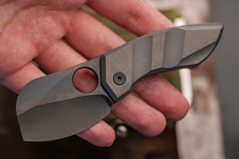 Close up of hand grip on EDC folding knife handle scales