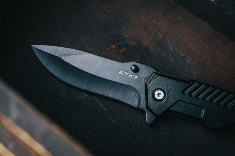 Budget EDC knife blade steel macro close up, D2 14C28N 8Cr comparison