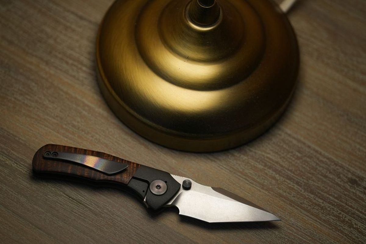 Premium EDC folding knife with wood handle, what an extra fifty dollars buys