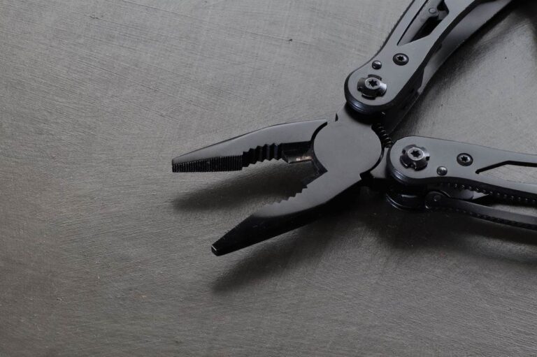Macro shot of a flagship black EDC multitool's pliers mechanism