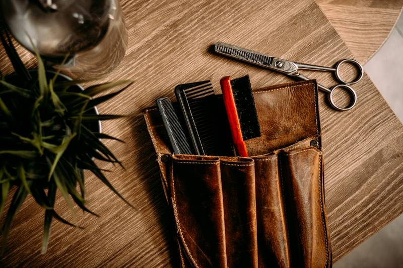 Leather EDC pocket organizer holding small tools for nurse carry