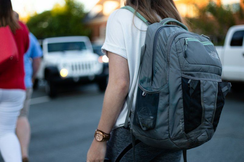Backpack straps distributing weight across both shoulders
