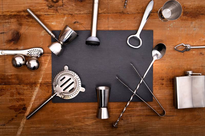 full bartender EDC kit flat lay with wine key, jigger, and bar tools