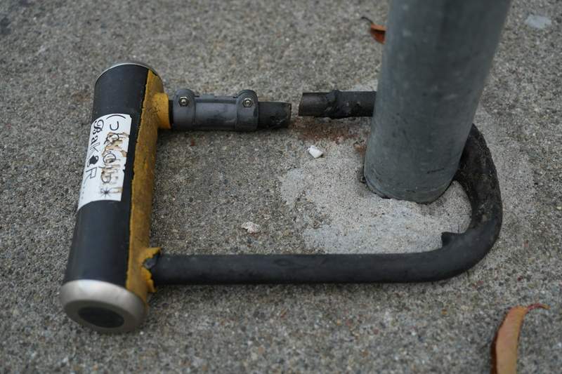 A U-lock securing a bike commuter EDC kit against theft