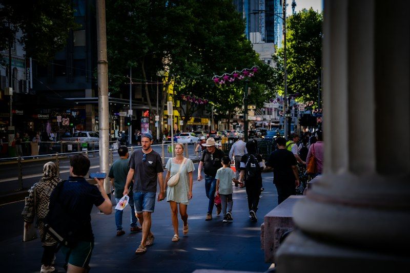 Busy city sidewalk where EDC bag security matters most