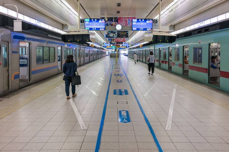 Commuters at a train station during the daily commute