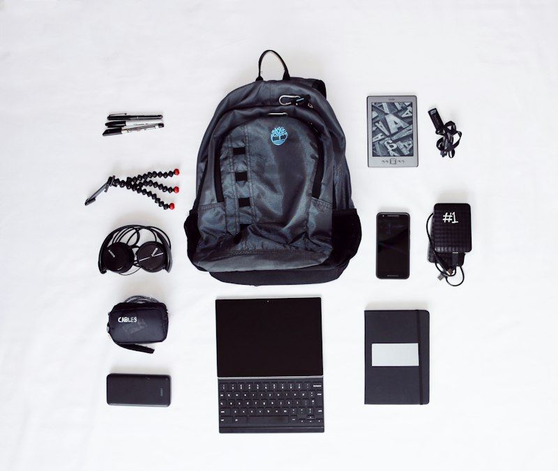 Backpack flat lay with full EDC gear loadout