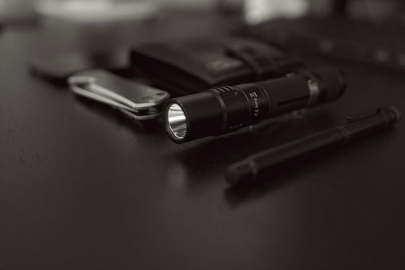 compact flashlight and power bank for parent edc