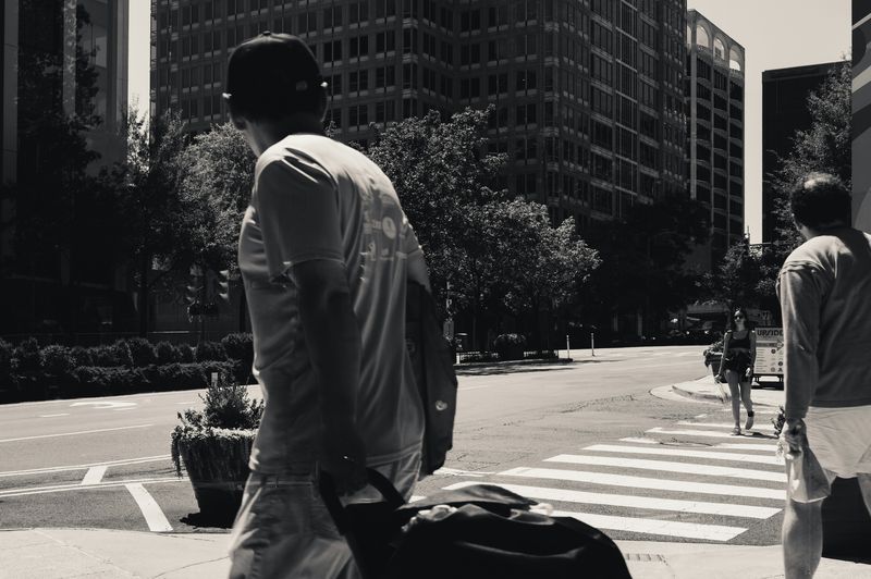 man carrying a bag during his daily commute in the city
