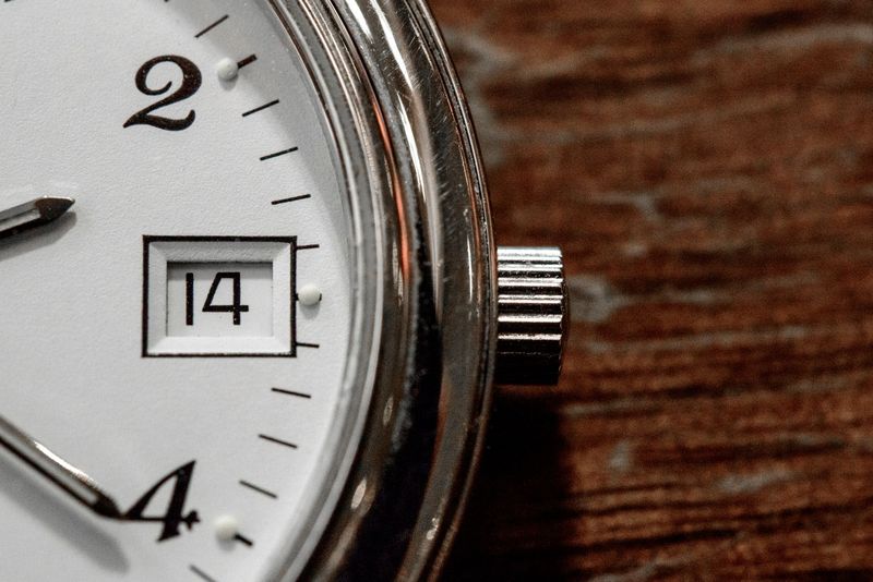 close-up of EDC watch dial and crystal showing legibility and date window
