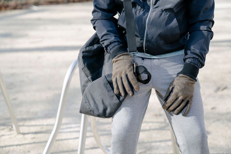 person wearing gloves in cold weather fall edc setup
