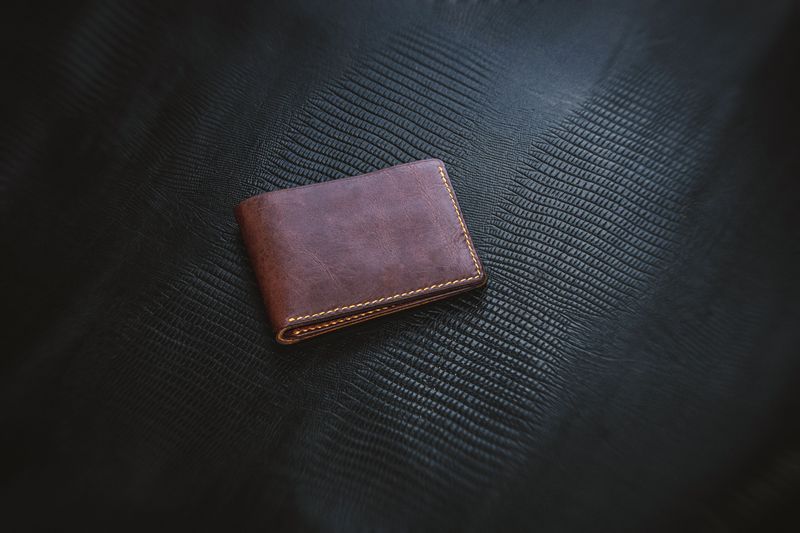 Close-up of leather wallet stitching and craftsmanship detail