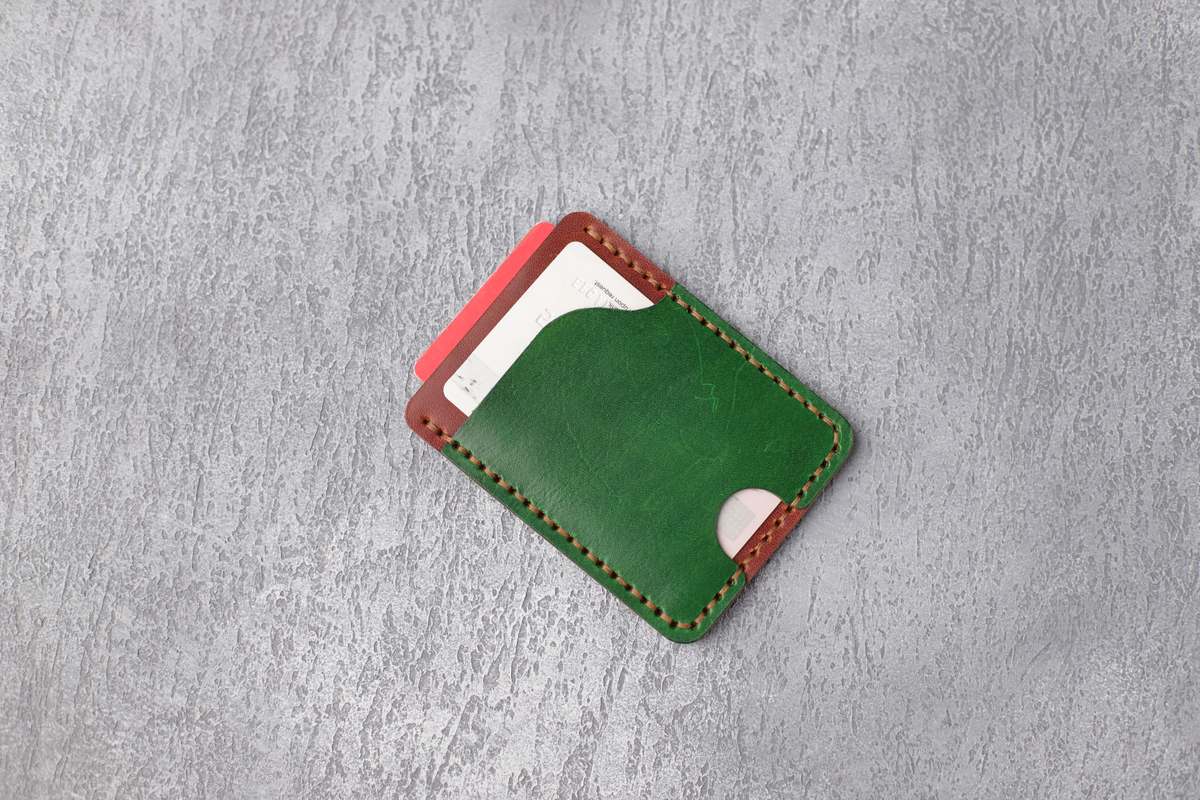Minimalist slim leather card wallet representing a lean EDC setup