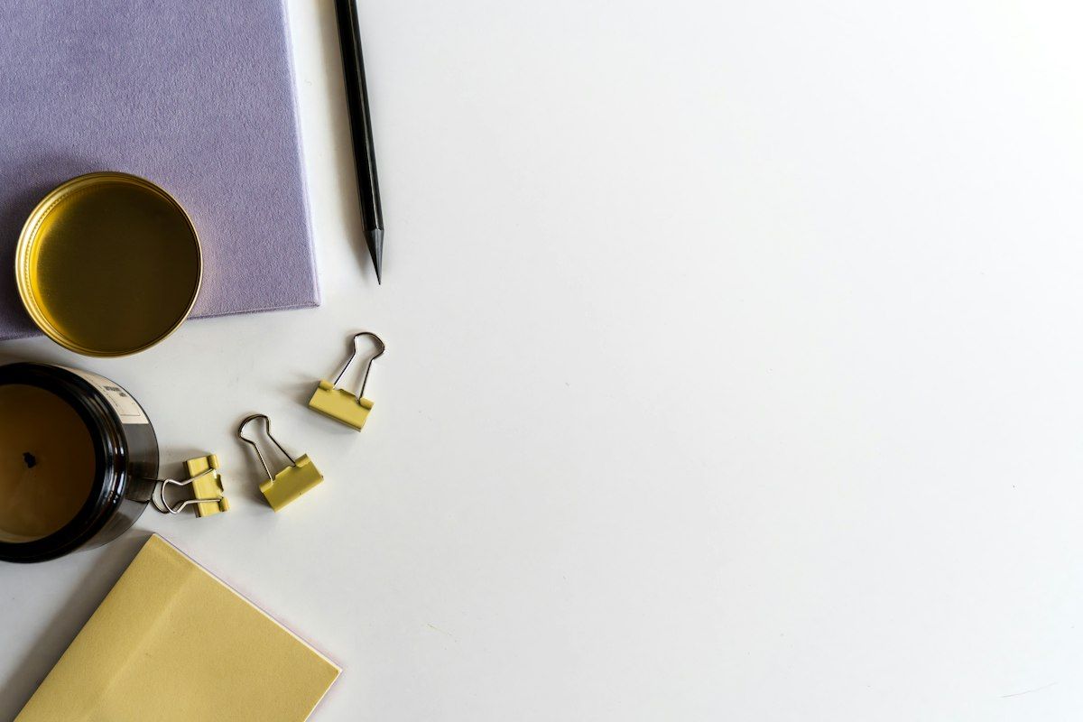 Office EDC essentials laid out on a desk including notebook and pen
