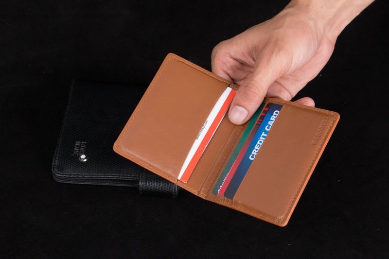 Slim bifold wallet with cards, a key piece of commuter EDC
