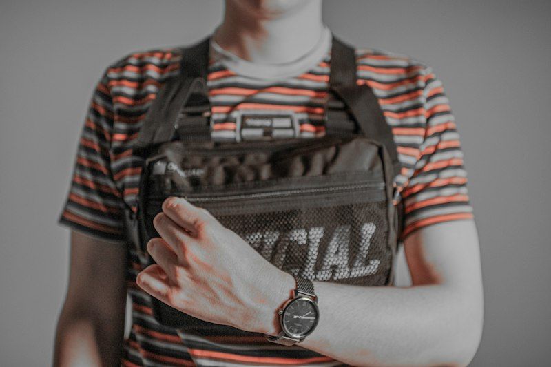 Quick access to a sling bag front pocket while on the move